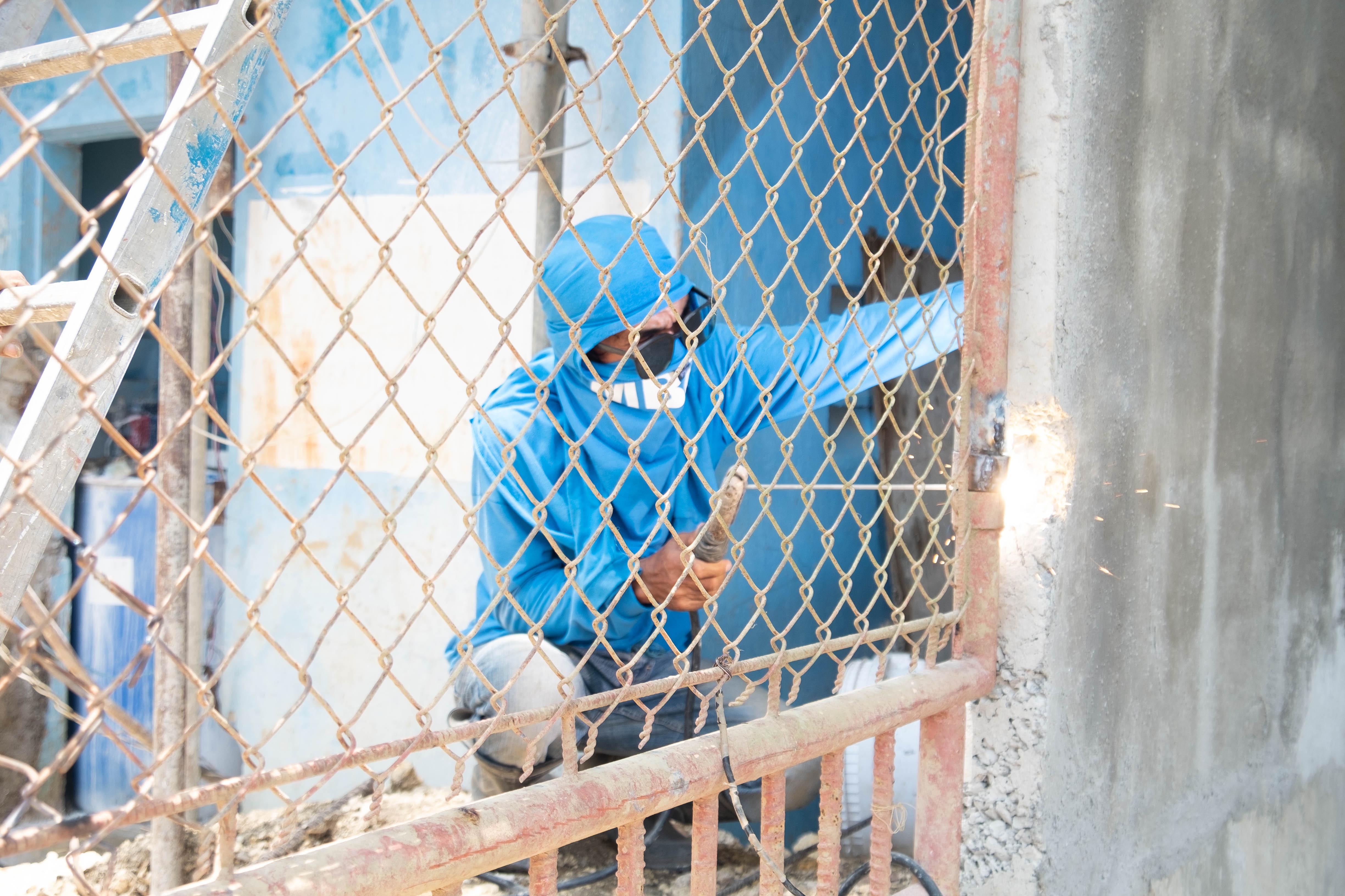 Professional repair technician working on property